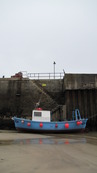 SX08775 Small blue fishing boat in Newquay Harbour.jpg